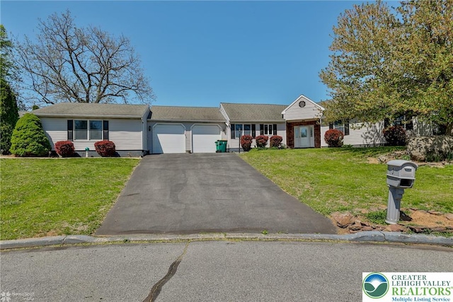 3 Dusty Rd, Palmer Twp, PA 18045 - view of front of property with a garage, driveway, and a front yard