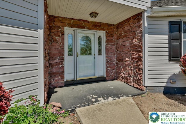 3 Dusty Rd, Palmer Twp, PA 18045 - doorway to property featuring brick siding, stone siding, and roof with shingles