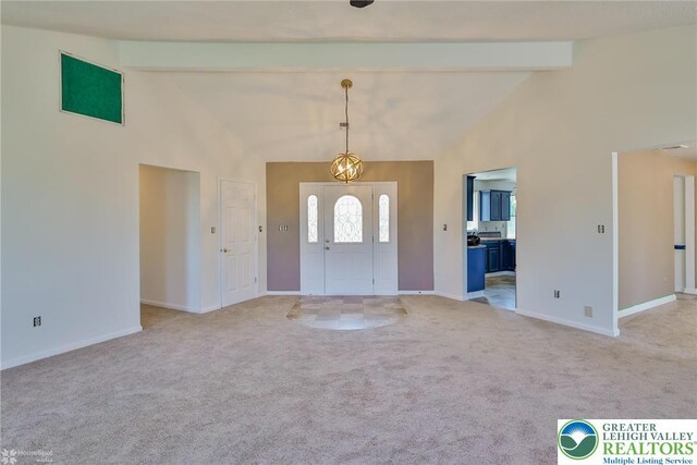 3 Dusty Rd, Palmer Twp, PA 18045 - foyer entrance with high vaulted ceiling, baseboards, beamed ceiling, and light colored carpet