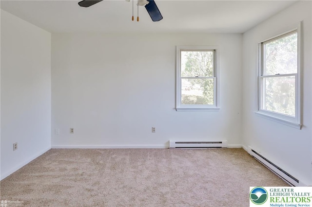 empty room featuring carpet floors, ceiling fan, and baseboard heating