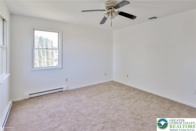 carpeted empty room with visible vents, baseboards, ceiling fan, baseboard heating, and a baseboard heating unit