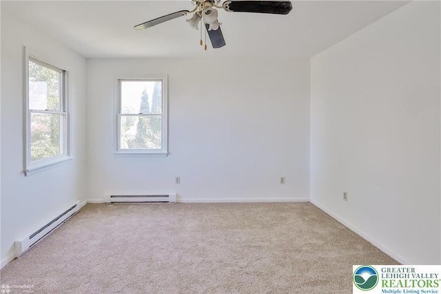 carpeted empty room featuring baseboards, a ceiling fan, and a baseboard heating unit