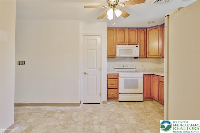 kitchen featuring brown cabinets, white appliances, light countertops, a ceiling fan, and baseboards