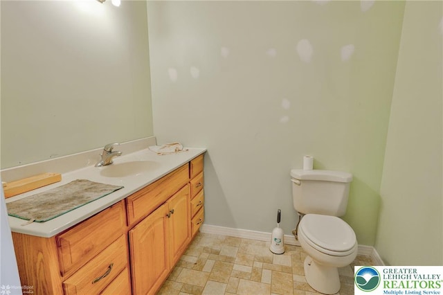 3 Dusty Rd, Palmer Twp, PA 18045 - bathroom with toilet, baseboards, and vanity