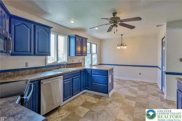 kitchen with blue cabinetry, dishwasher, a sink, ceiling fan with notable chandelier, and a peninsula