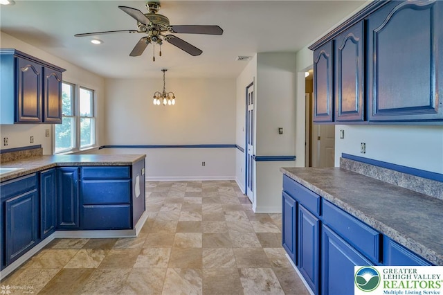 kitchen with blue cabinetry, visible vents, dark countertops, and ceiling fan with notable chandelier