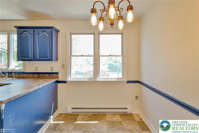 interior space featuring baseboards, a baseboard radiator, blue cabinets, and a chandelier