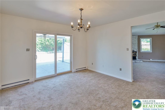 empty room featuring carpet floors, baseboards, ceiling fan with notable chandelier, and a baseboard radiator