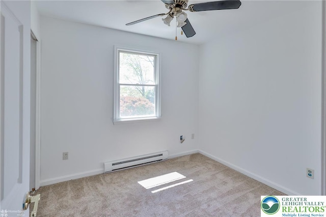 unfurnished room featuring a ceiling fan, baseboards, baseboard heating, and carpet