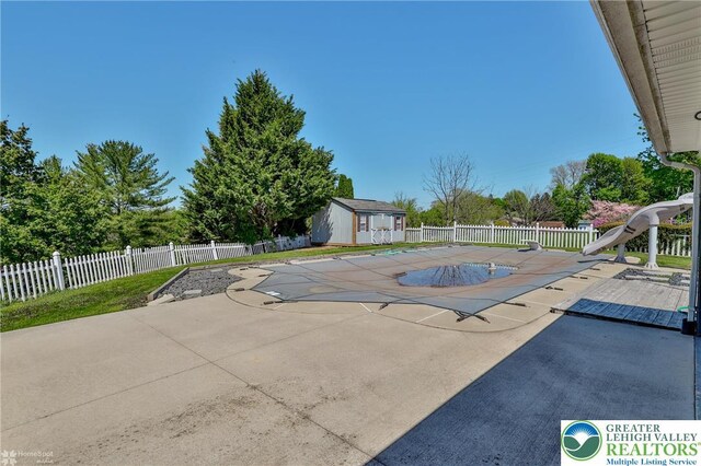 3 Dusty Rd, Palmer Twp, PA 18045 - view of swimming pool featuring a fenced in pool, a patio area, a water slide, and fence