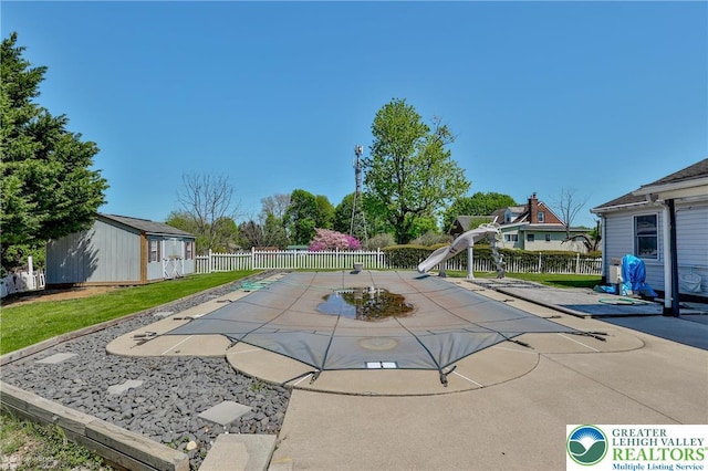 3 Dusty Rd, Palmer Twp, PA 18045 - view of swimming pool with a fenced backyard, a water slide, an outdoor structure, and a patio area