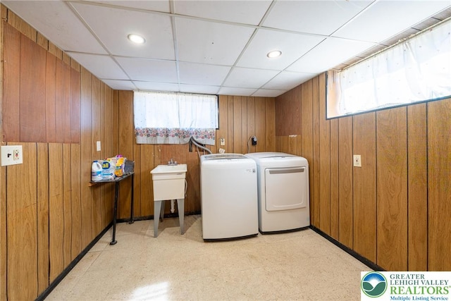 3040 Keystone St, Bethlehem Twp, PA 18020 - clothes washing area with washing machine and clothes dryer, wooden walls, laundry area, and light floors