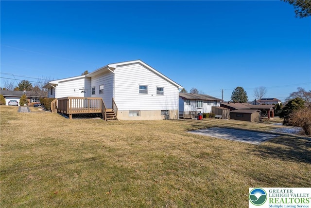 3040 Keystone St, Bethlehem Twp, PA 18020 - back of house featuring a lawn and a wooden deck
