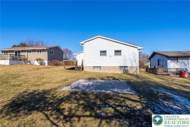 3040 Keystone St, Bethlehem Twp, PA 18020 - back of property with a lawn, a wooden deck, and a patio area