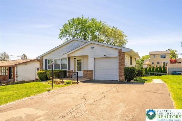 3040 Keystone St, Bethlehem Twp, PA 18020 - ranch-style house with driveway, a garage, brick siding, fence, and a front lawn