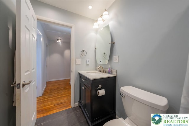 3040 Keystone St, Bethlehem Twp, PA 18020 - half bath with vanity, tile patterned floors, baseboards, toilet, and recessed lighting