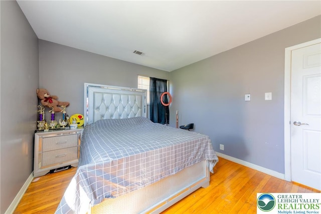 3040 Keystone St, Bethlehem Twp, PA 18020 - bedroom featuring baseboards, visible vents, and wood finished floors