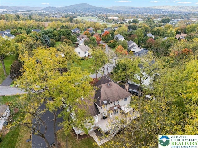 drone / aerial view featuring a mountain view