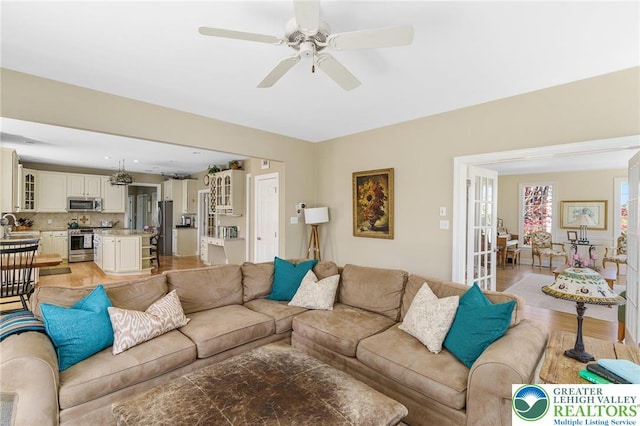 living room featuring ceiling fan