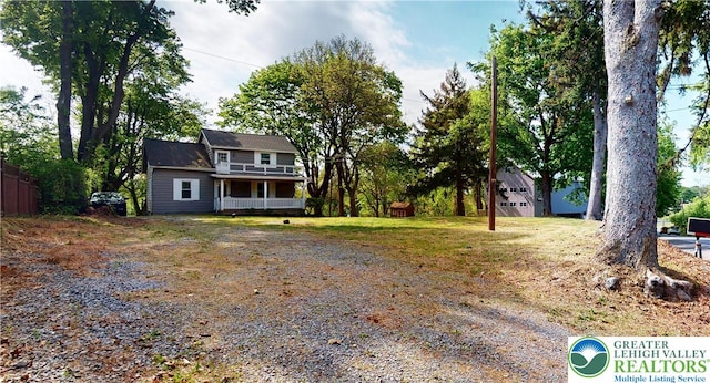 view of front of home featuring a porch and driveway