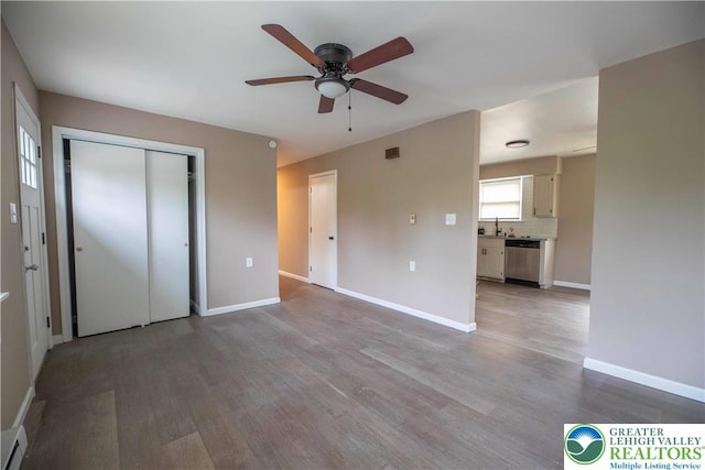 1231 Fairmount St, Bethlehem City, PA 18017 - unfurnished bedroom with a sink, baseboards, a closet, and wood finished floors