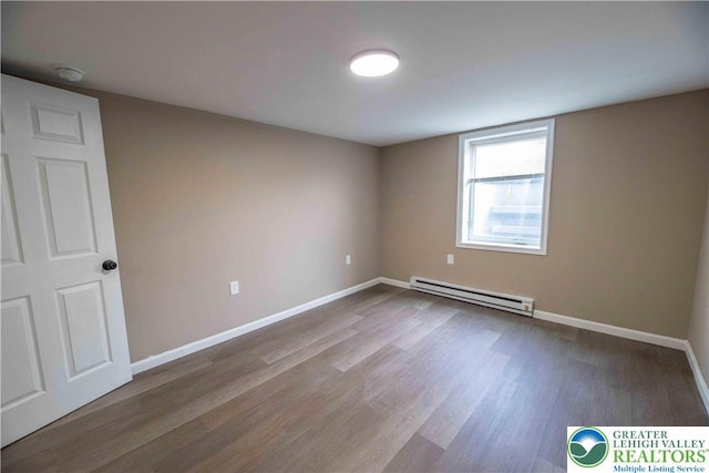 1231 Fairmount St, Bethlehem City, PA 18017 - spare room featuring baseboards, a baseboard radiator, and wood finished floors