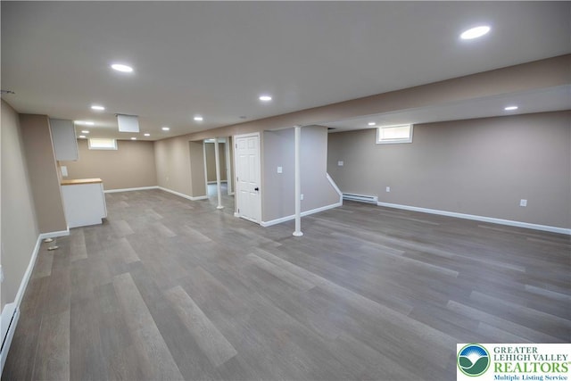 1231 Fairmount St, Bethlehem City, PA 18017 - basement featuring recessed lighting, baseboards, a baseboard radiator, and light wood-type flooring