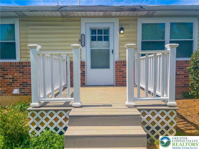 1231 Fairmount St, Bethlehem City, PA 18017 - property entrance with a wooden deck and brick siding
