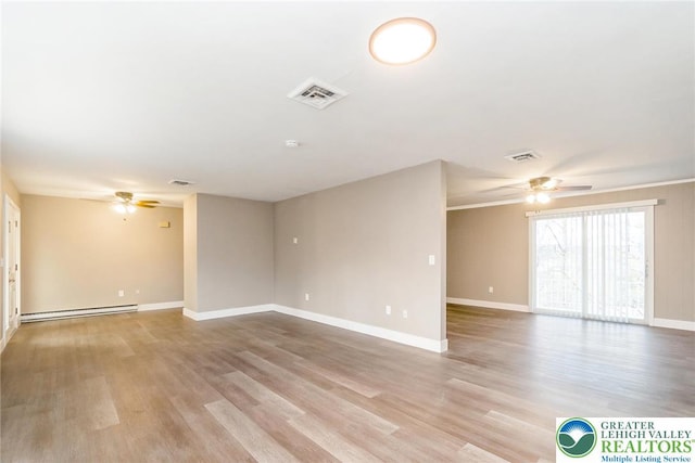 unfurnished room featuring a ceiling fan, visible vents, baseboard heating, and light wood finished floors