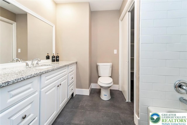 full bath featuring toilet, baseboards, and vanity
