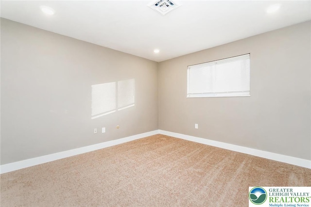carpeted empty room with baseboards, recessed lighting, and visible vents
