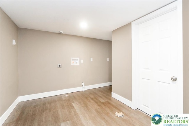laundry room featuring hookup for an electric dryer, light wood-type flooring, baseboards, and hookup for a washing machine
