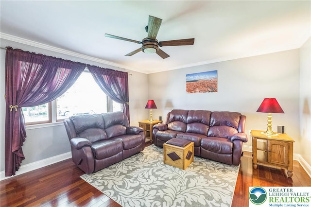 living area with crown molding, baseboards, ceiling fan, and wood-type flooring