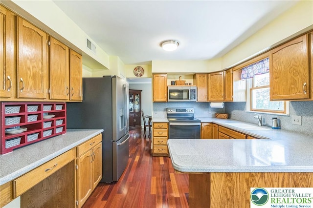 kitchen with visible vents, a sink, light countertops, and stainless steel appliances