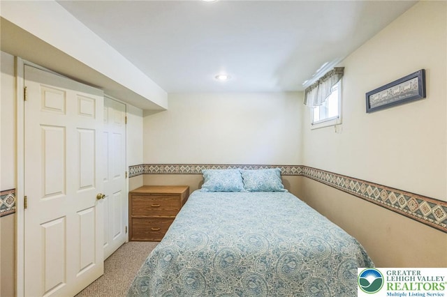 bedroom with carpet floors and recessed lighting