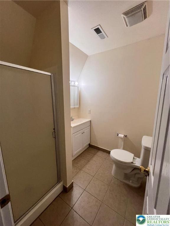 bathroom with tile patterned flooring, a shower stall, toilet, and visible vents