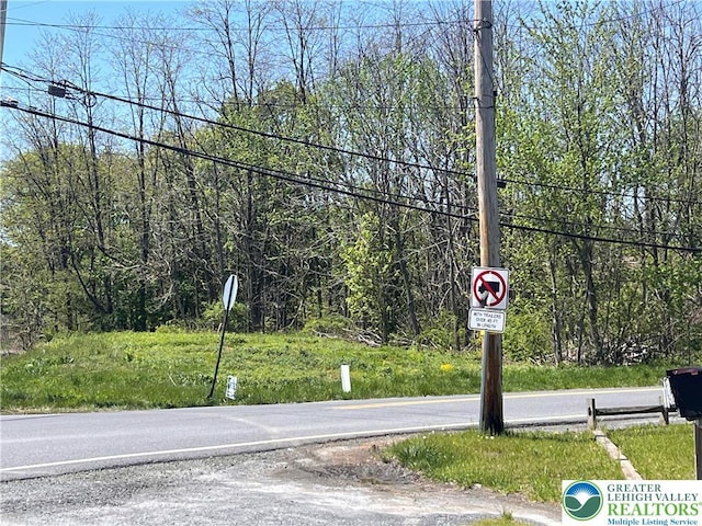 view of road with traffic signs