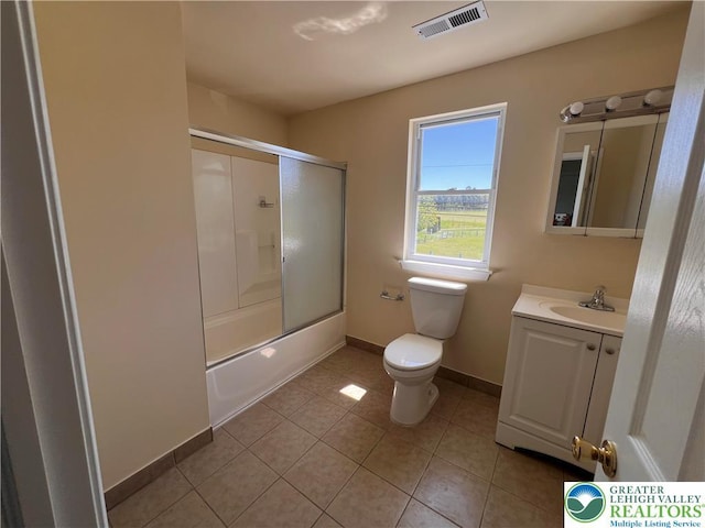 full bath featuring vanity, toilet, tile patterned floors, baseboards, and visible vents