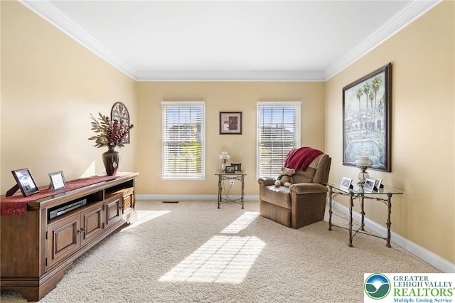 living area featuring crown molding, baseboards, and light carpet
