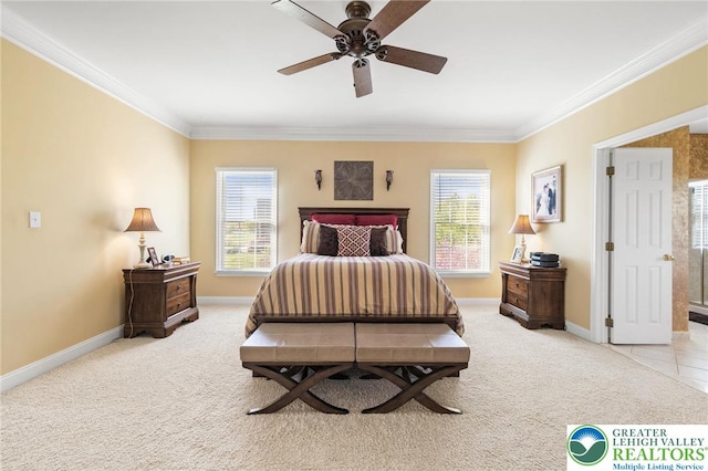 bedroom with light colored carpet, a ceiling fan, baseboards, and crown molding