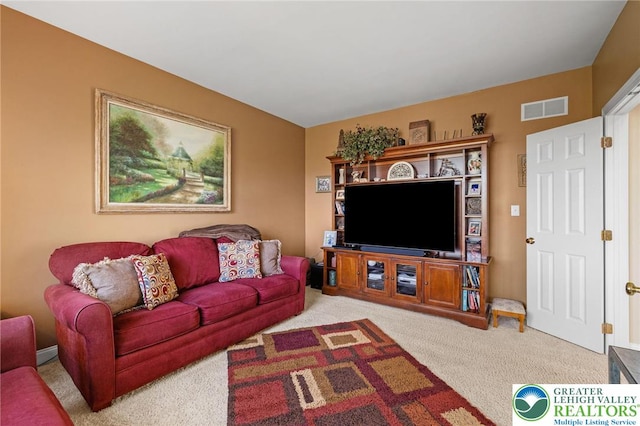 living area with carpet flooring and visible vents