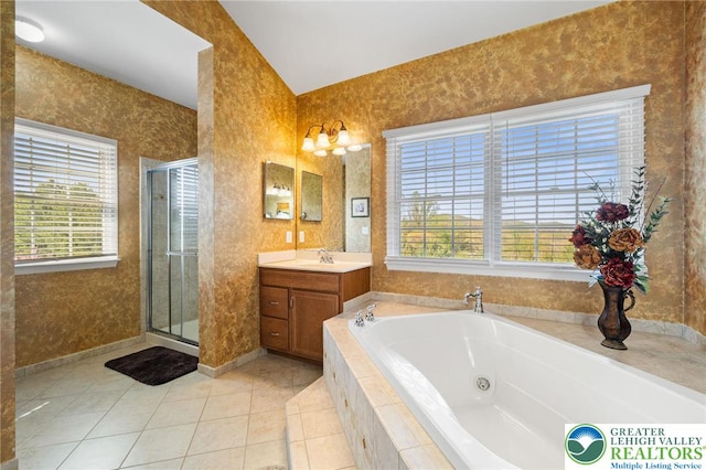 full bath featuring tile patterned flooring, a healthy amount of sunlight, and a shower stall