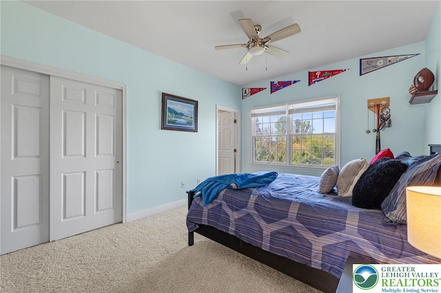 carpeted bedroom with baseboards, a ceiling fan, and a closet