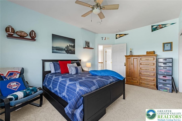 carpeted bedroom with a ceiling fan