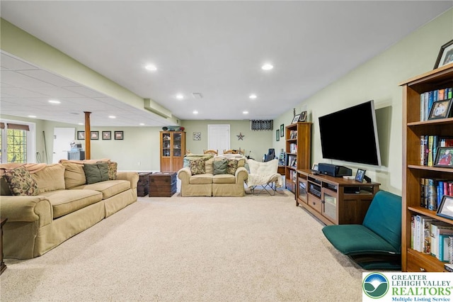 carpeted living area with recessed lighting
