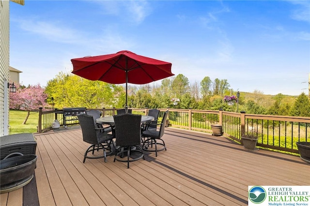 deck featuring outdoor dining area