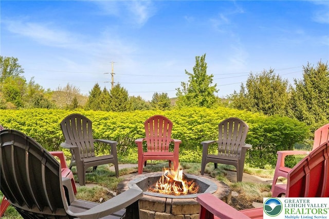 view of patio with an outdoor fire pit