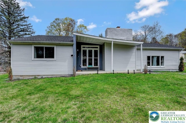 134 Altemose Rd, Tobyhanna Twp, PA 18347 - rear view of property featuring a yard and a chimney