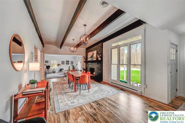 134 Altemose Rd, Tobyhanna Twp, PA 18347 - dining area with beam ceiling, a chandelier, a wealth of natural light, and wood finished floors