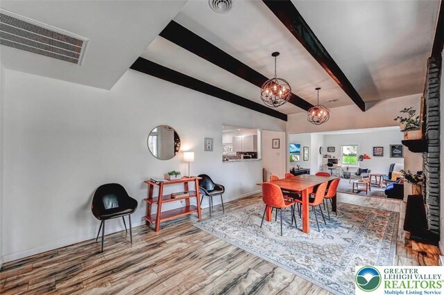 134 Altemose Rd, Tobyhanna Twp, PA 18347 - dining area with visible vents, wood finished floors, beamed ceiling, baseboards, and a notable chandelier